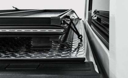 Access LOMAX Tri-Fold Cover Black Urethane 2019-2027 Dodge Ram - 5ft 7in Bed (Except Classic w/o RamBox)