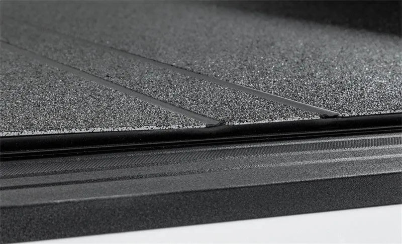 Access LOMAX Tri-Fold Cover Black Urethane Split Rail 19+ Ram 1500(new body) - 6ft 4in Bed (w/o RamBox)